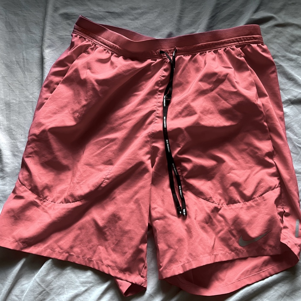 look new just a little rip in the back but if u have a shirt on it will cover it